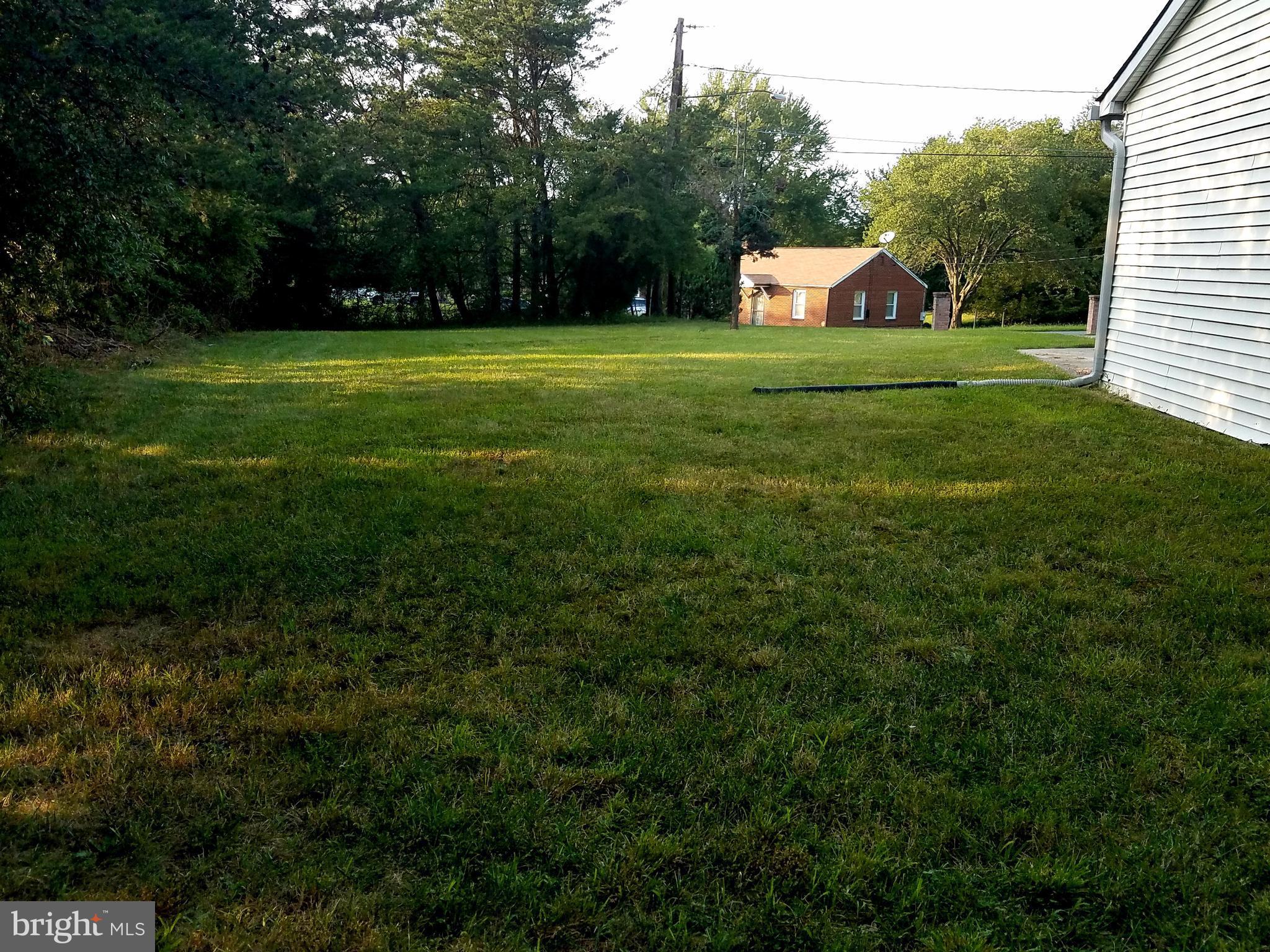 6901 Friendship Road Clinton, MD 20735 - Photo 26 of 26 a front view of a house with a yard