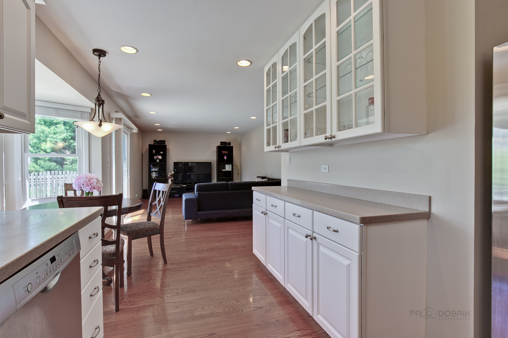1300 Devonshire Road Buffalo Grove, IL 60089 - Photo 11 of 34 a kitchen with cabinets and chairs
