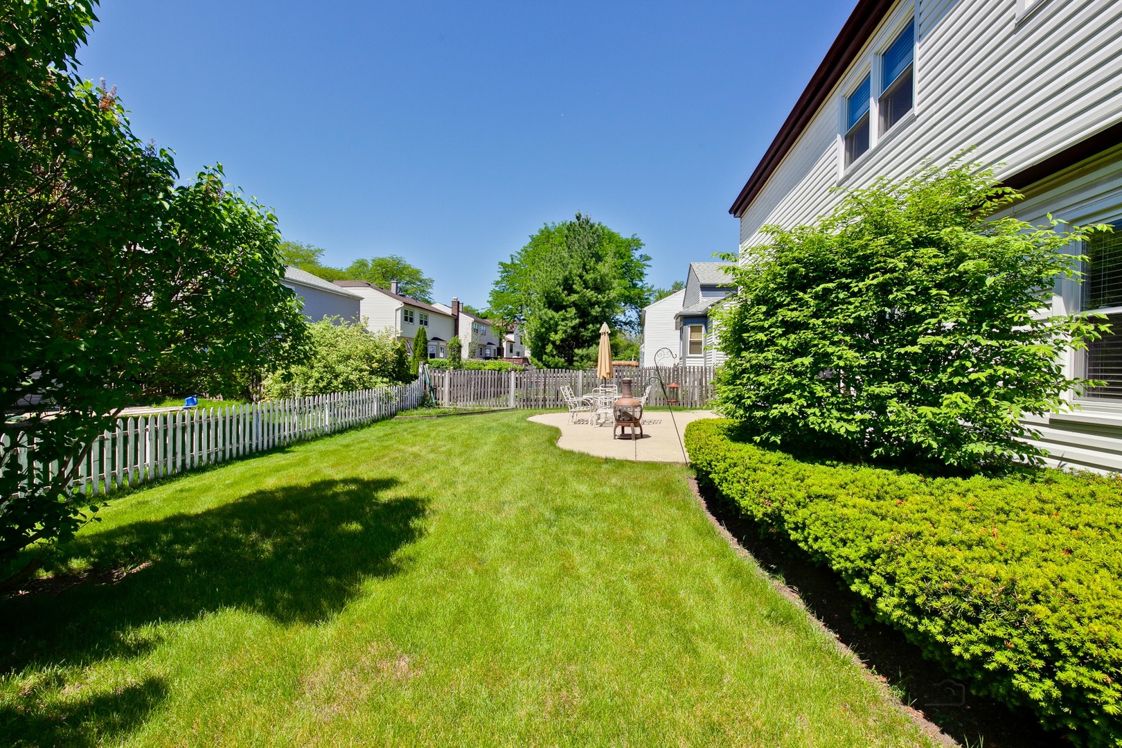 1300 Devonshire Road Buffalo Grove, IL 60089 - Photo 34 of 34 a view of yard with swimming pool and green space