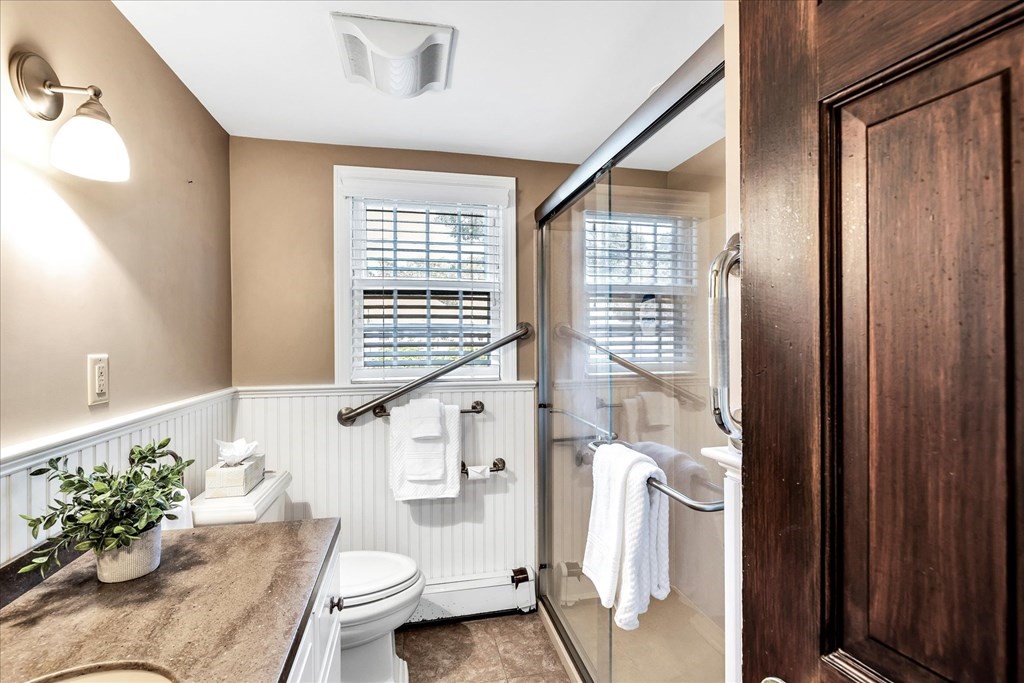 56 Danas Path Yarmouth, MA 02673 - Photo 15 of 32 a bathroom with a sink toilet and shower