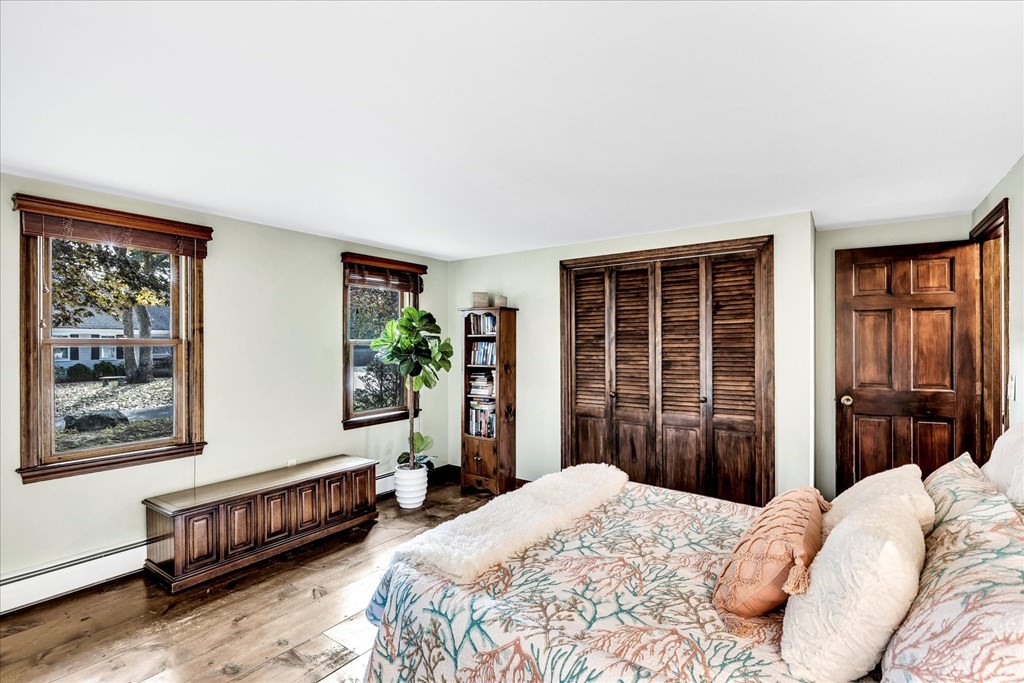 56 Danas Path Yarmouth, MA 02673 - Photo 17 of 32 a bedroom with a bed and a window