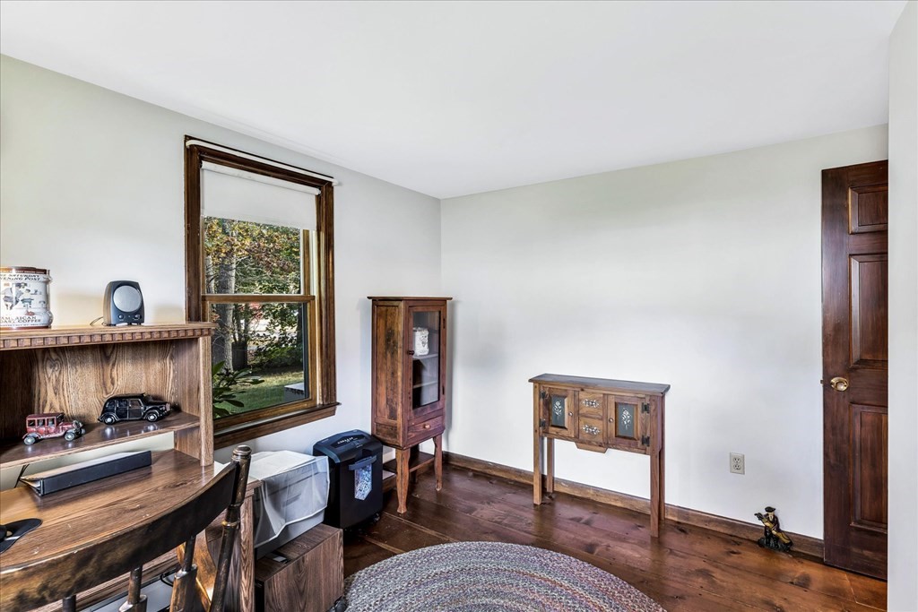 56 Danas Path Yarmouth, MA 02673 - Photo 19 of 32 a view of a livingroom with furniture and a fireplace
