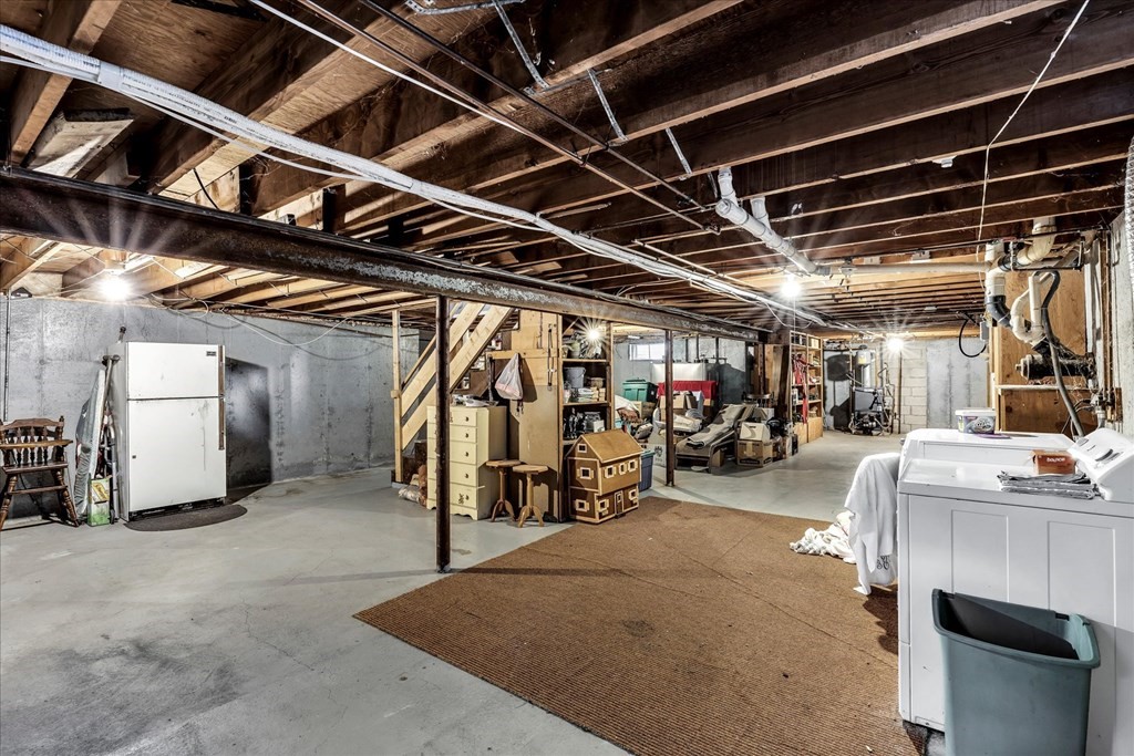 56 Danas Path Yarmouth, MA 02673 - Photo 21 of 32 a view of parking garage with cars