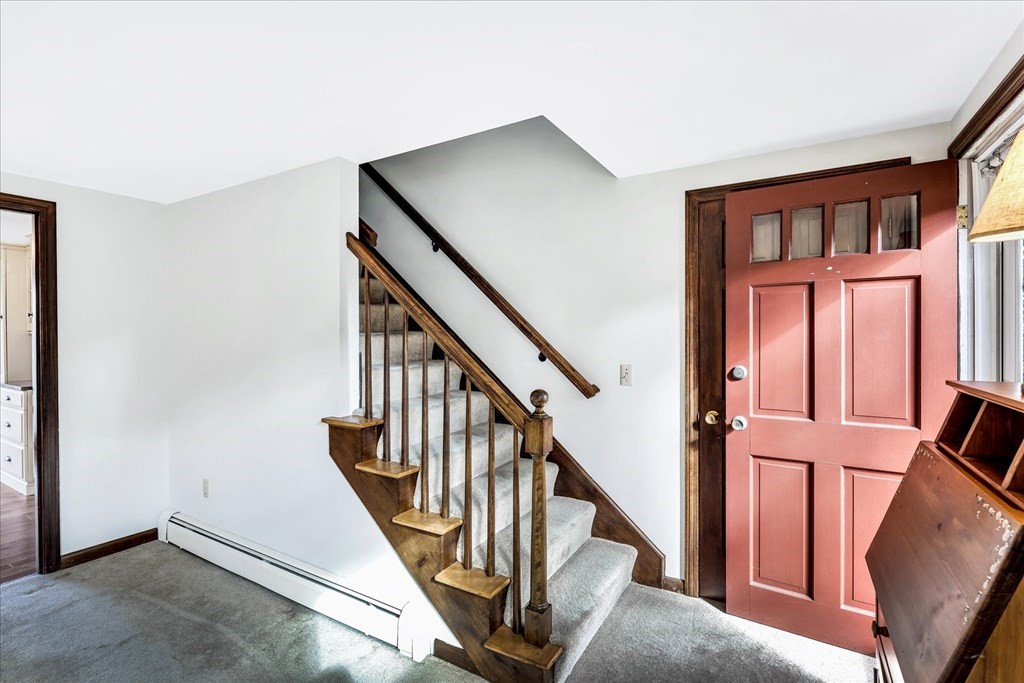 56 Danas Path Yarmouth, MA 02673 - Photo 23 of 32 a view of staircase with lots of windows and white walls