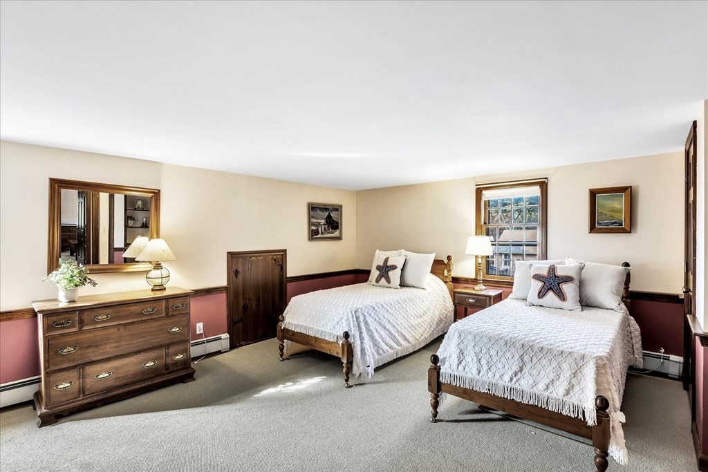 56 Danas Path Yarmouth, MA 02673 - Photo 29 of 32 a spacious bedroom with two beds and dresser