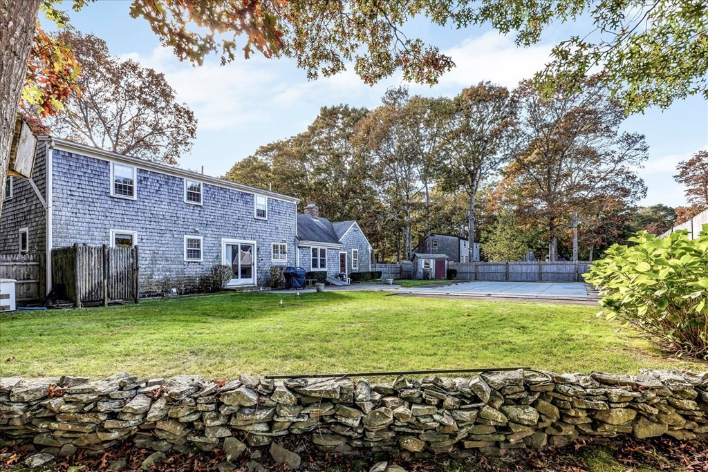 56 Danas Path Yarmouth, MA 02673 - Photo 3 of 32 a view of a house with a yard