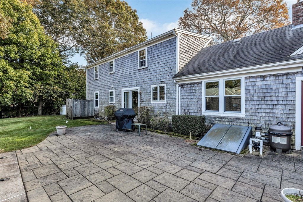 56 Danas Path Yarmouth, MA 02673 - Photo 4 of 32 a view of a house with backyard and sitting area