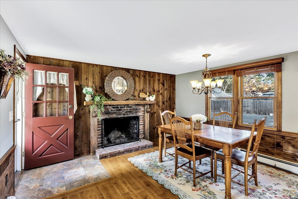 56 Danas Path Yarmouth, MA 02673 - Photo 5 of 32 a view of a livingroom with furniture and a fireplace