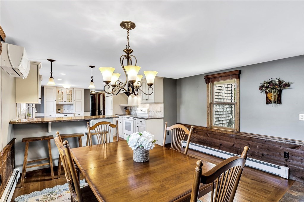 56 Danas Path Yarmouth, MA 02673 - Photo 7 of 32 a dining room with furniture and wooden floor