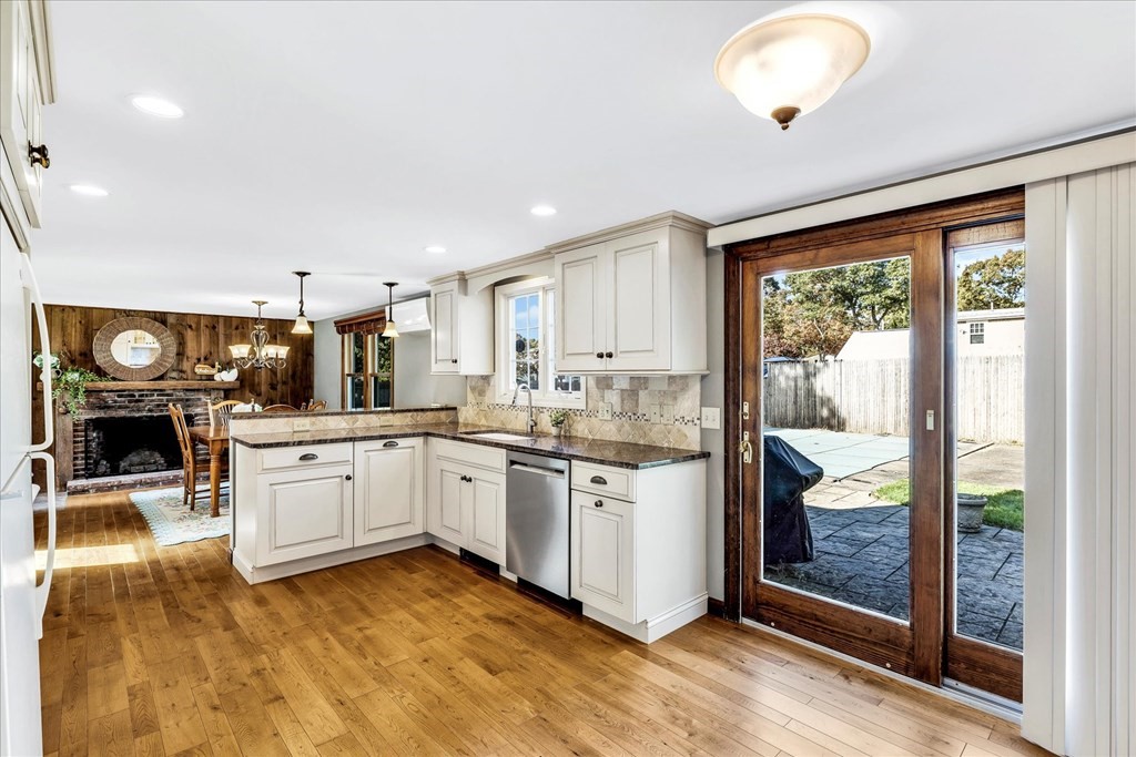 56 Danas Path Yarmouth, MA 02673 - Photo 8 of 32 a kitchen with a white cabinets and outdoor view