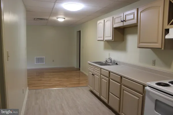 a bathroom with a sink a vanity and mirror