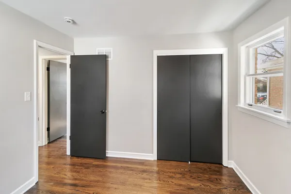 a view of entryway with wooden floor