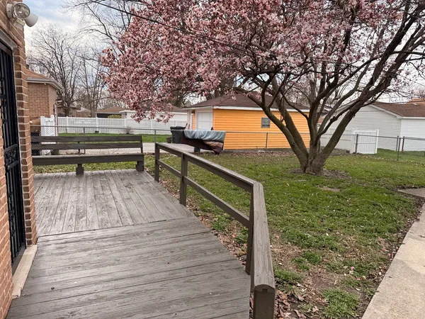 a view of outdoor space with garden and trees