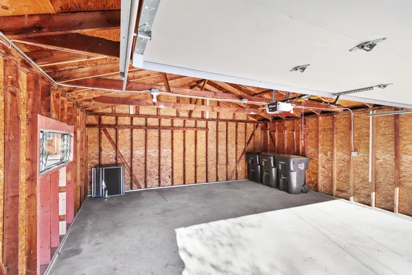 a view of a room with a couch and wooden floor