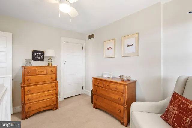 a room with furniture and a dresser