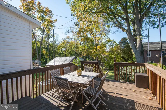 a view of balcony with furniture and wooden deck