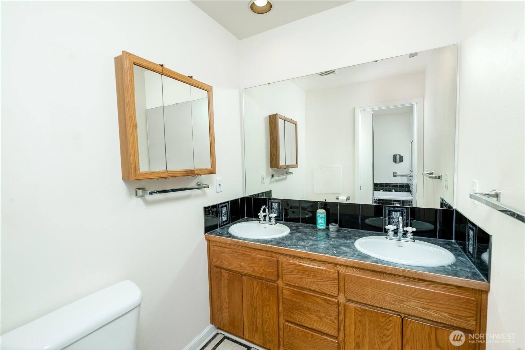 301 Mt Pleasant Estates Road Port Angeles, WA 98362 - Photo 18 of 40 a bathroom with 2 sink and a mirror