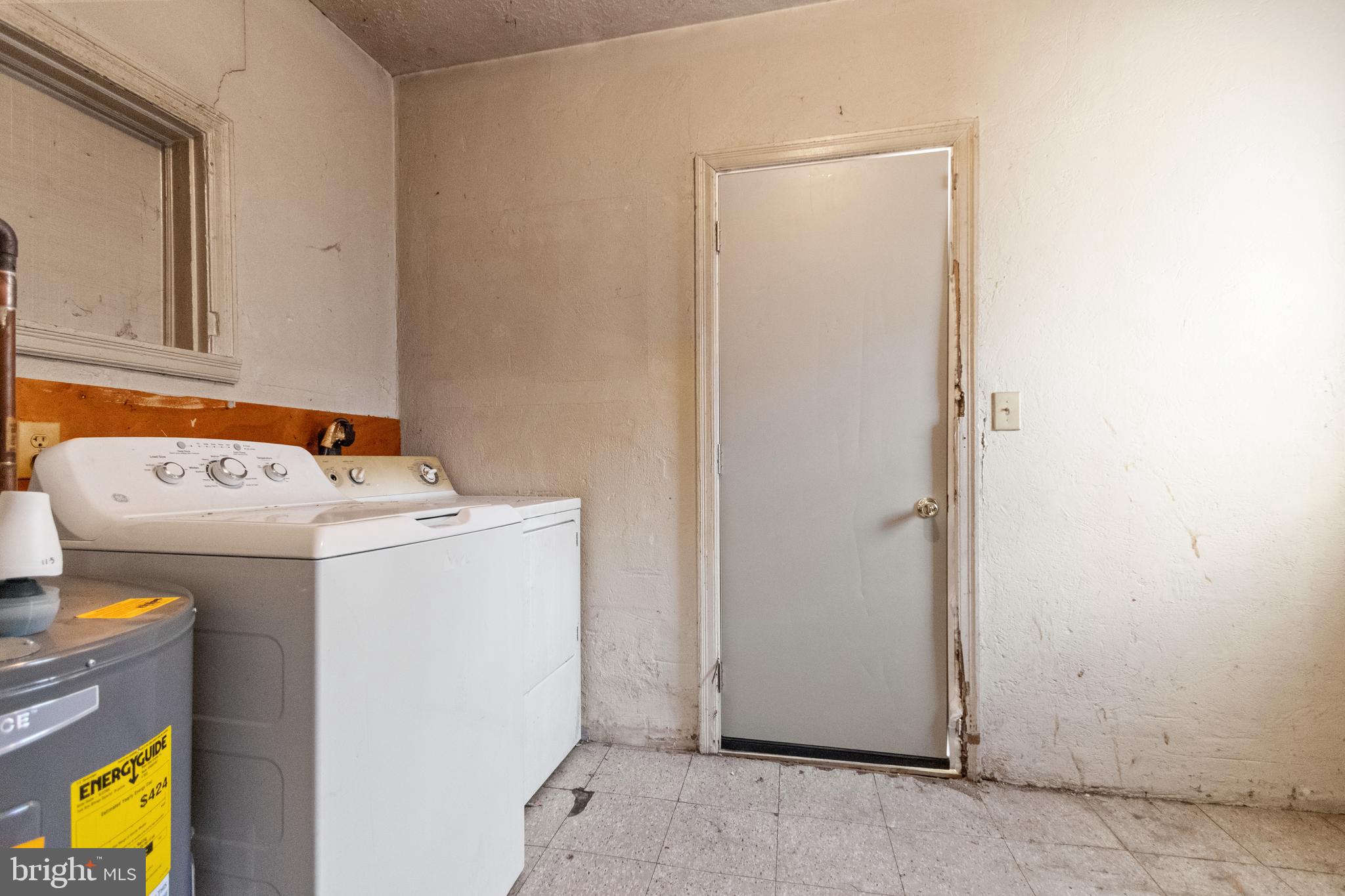 6009 Old Silver Hill Road District Heights, MD 20747 - Photo 14 of 24 a utility room with dryer and washer