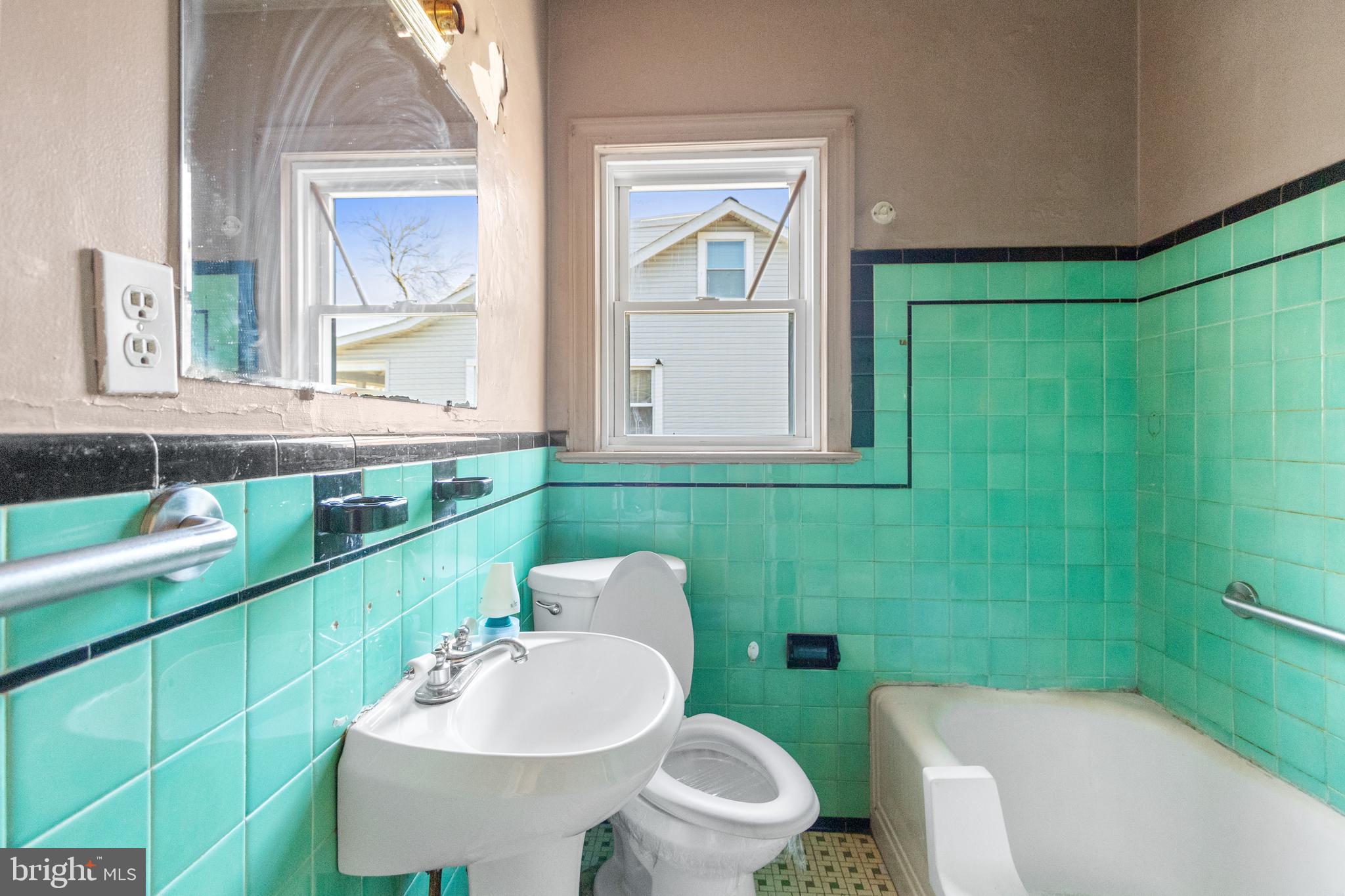 6009 Old Silver Hill Road District Heights, MD 20747 - Photo 19 of 24 a bathroom with a sink a toilet and mirror