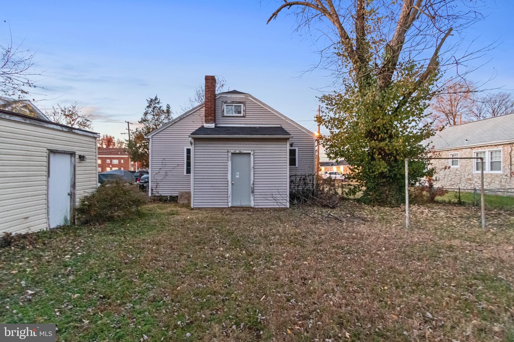 6009 Old Silver Hill Road District Heights, MD 20747 - Photo 22 of 24 a view of a house with a yard