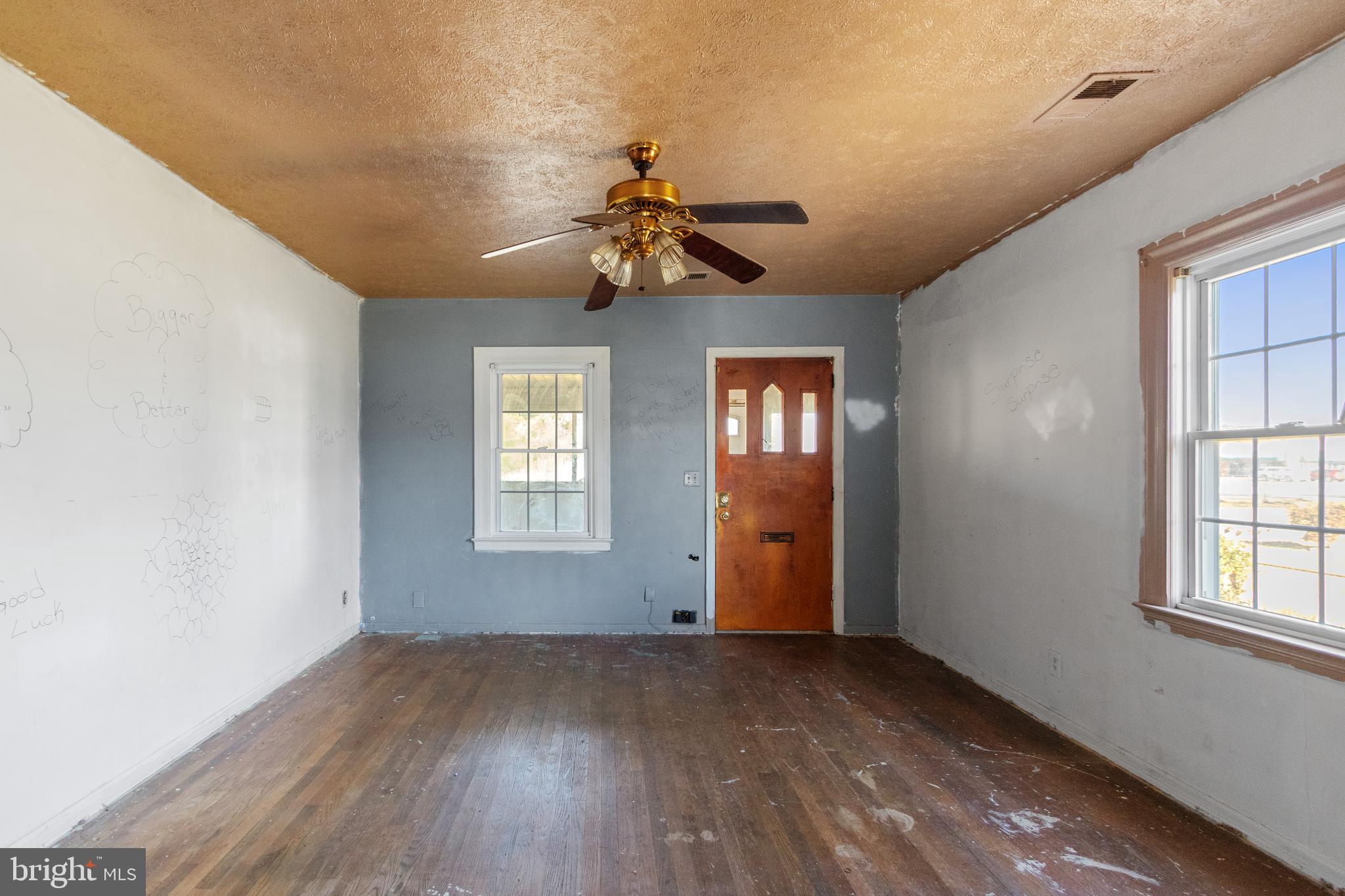 6009 Old Silver Hill Road District Heights, MD 20747 - Photo 6 of 24 wooden floor in an empty room with a window