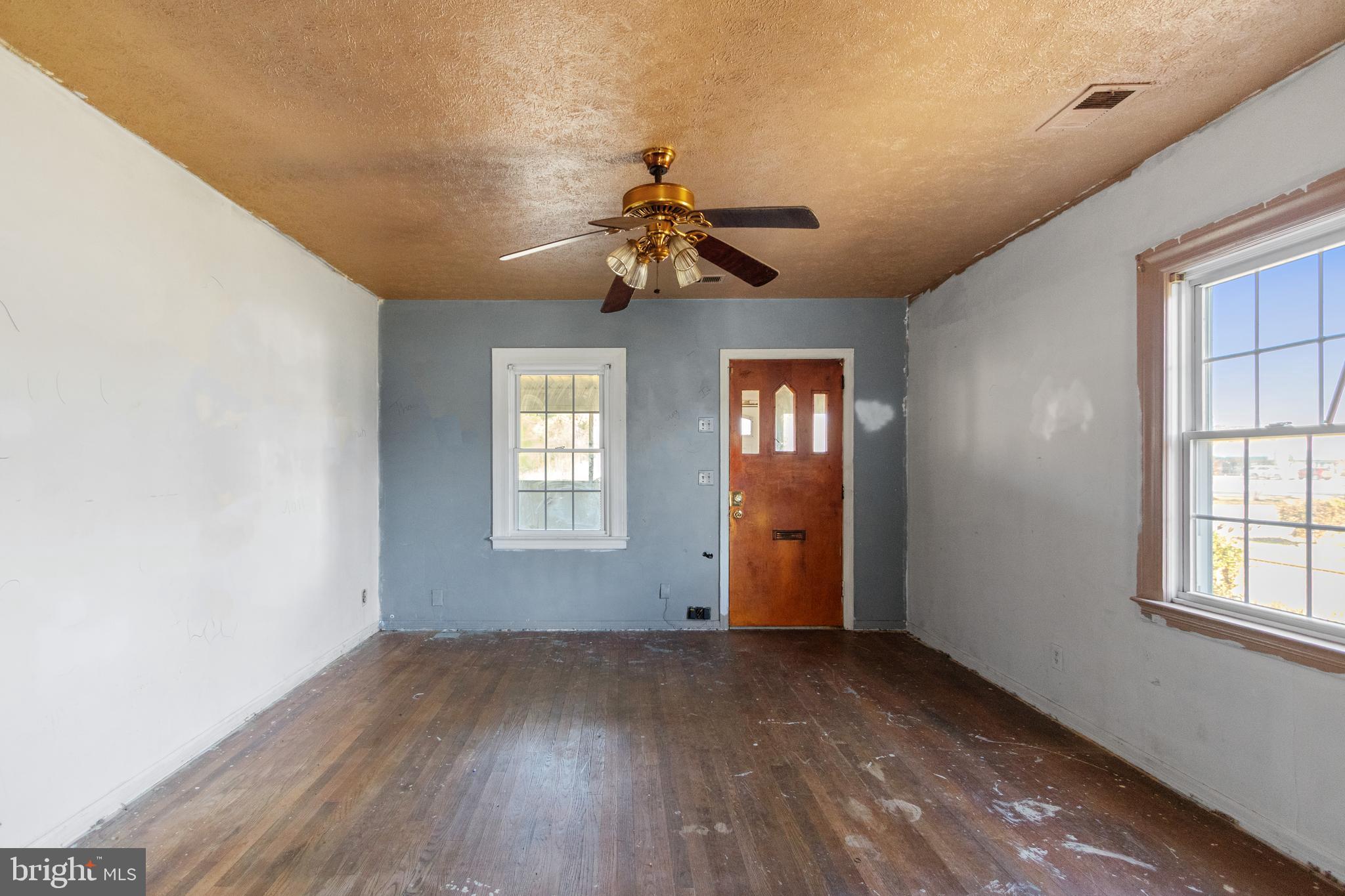 6009 Old Silver Hill Road District Heights, MD 20747 - Photo 7 of 24 wooden floor in an empty room with a window