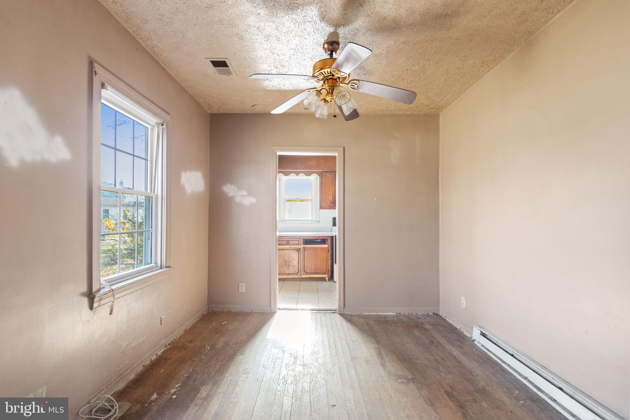 6009 Old Silver Hill Road District Heights, MD 20747 - Photo 8 of 24 wooden floor in an empty room with a window