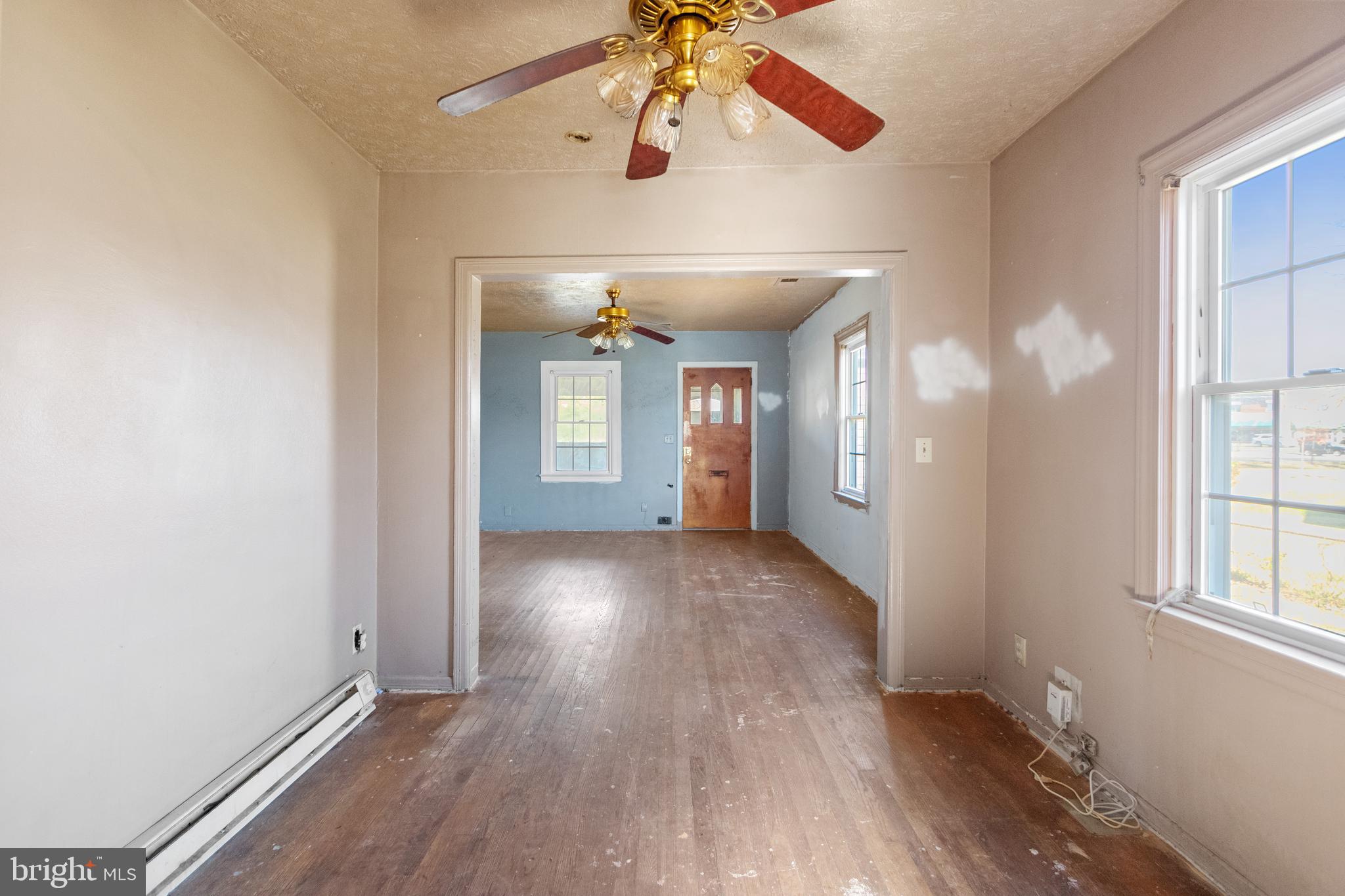 6009 Old Silver Hill Road District Heights, MD 20747 - Photo 9 of 24 a view of an empty room with window and wooden floor