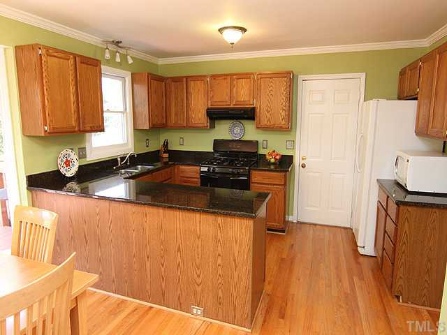 5402 Middleton Road Durham, NC 27713 - Photo 7 of 25 A view of the kitchen from the breakfast nook. Yes, the refrigerator conveys with the house! Kitchen