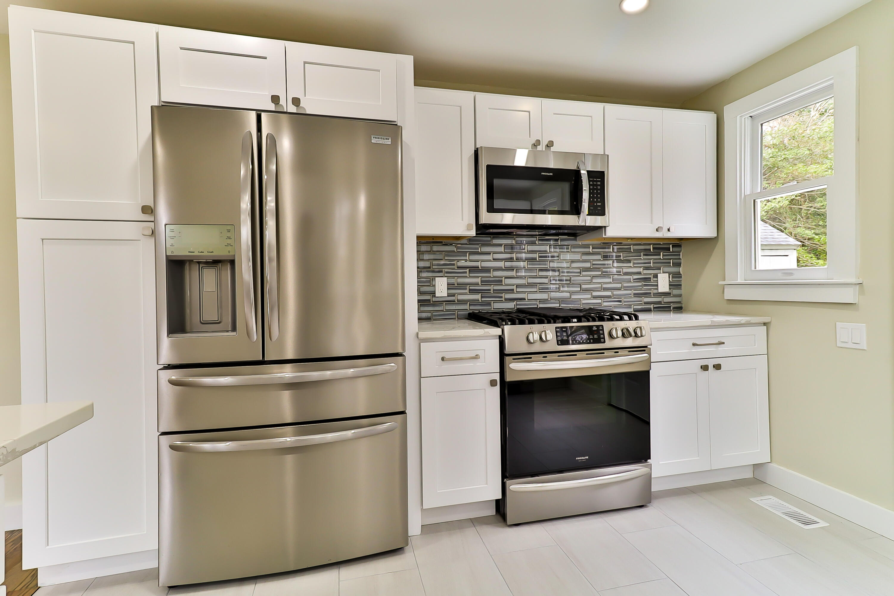 40 Richardson Road Centerville, MA 02632 - Photo 12 of 35 a kitchen with stainless steel appliances white cabinets and a refrigerator