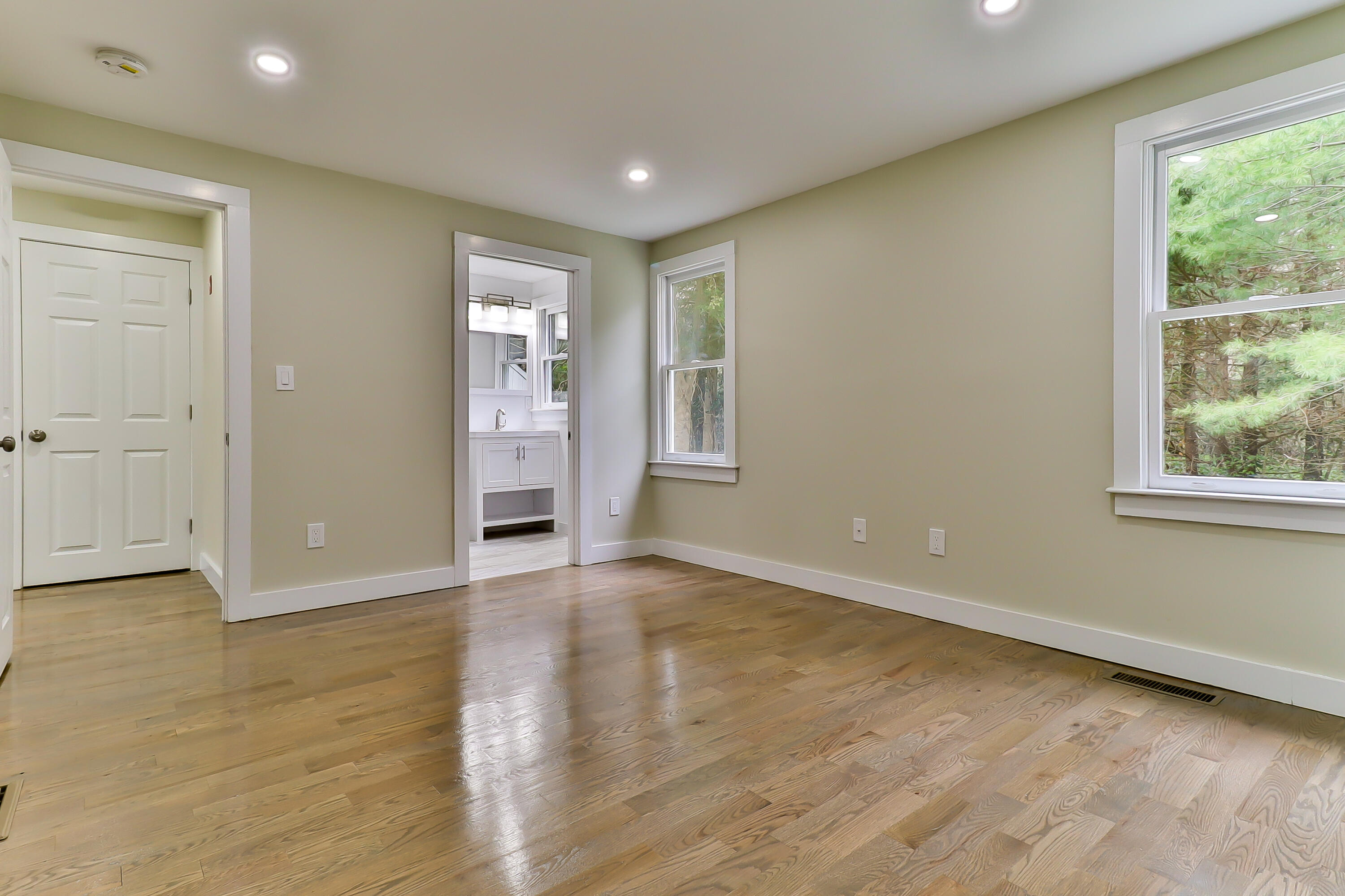40 Richardson Road Centerville, MA 02632 - Photo 13 of 35 an empty room with wooden floor and windows