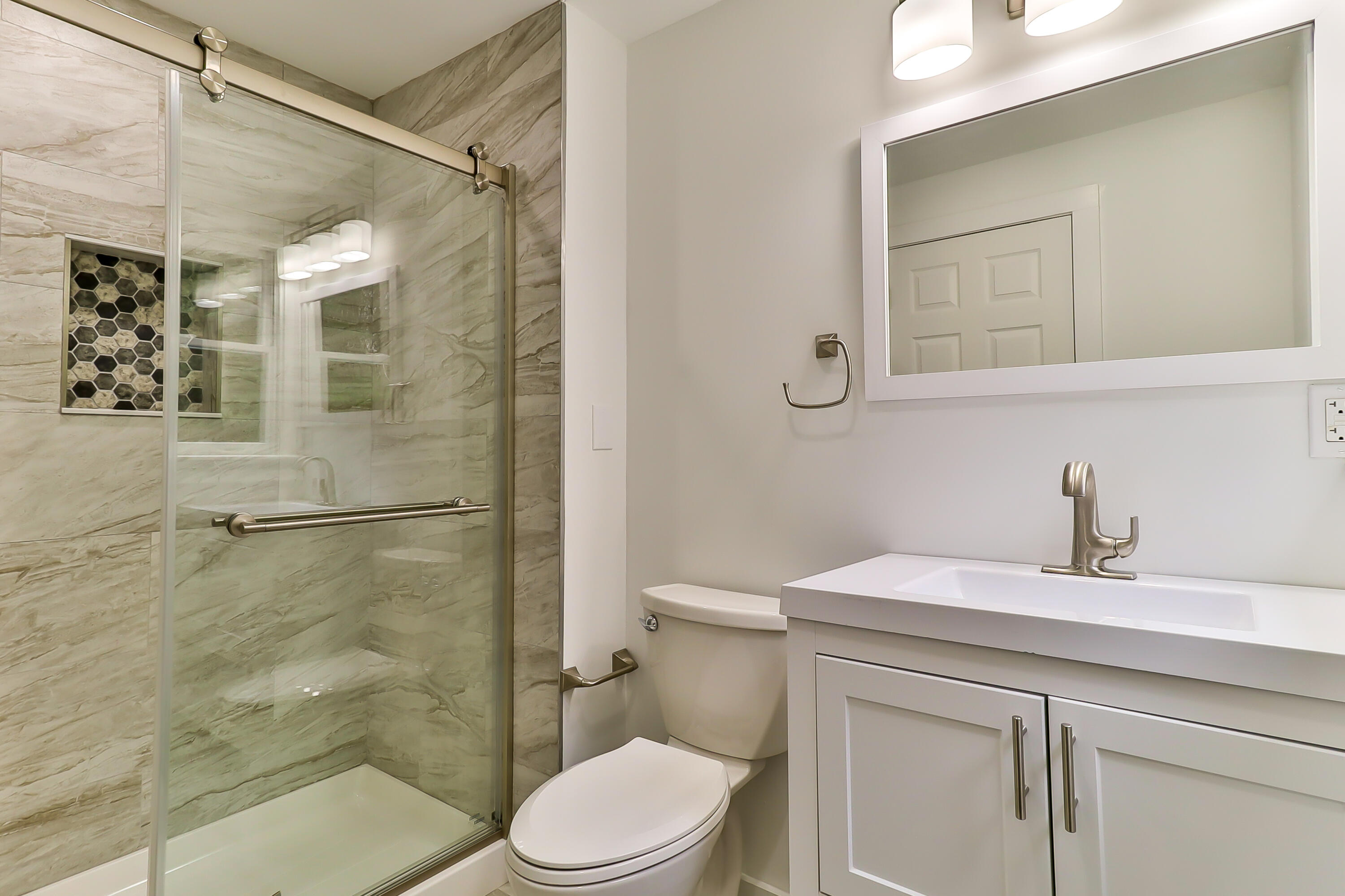 40 Richardson Road Centerville, MA 02632 - Photo 17 of 35 a bathroom with a sink a toilet and shower