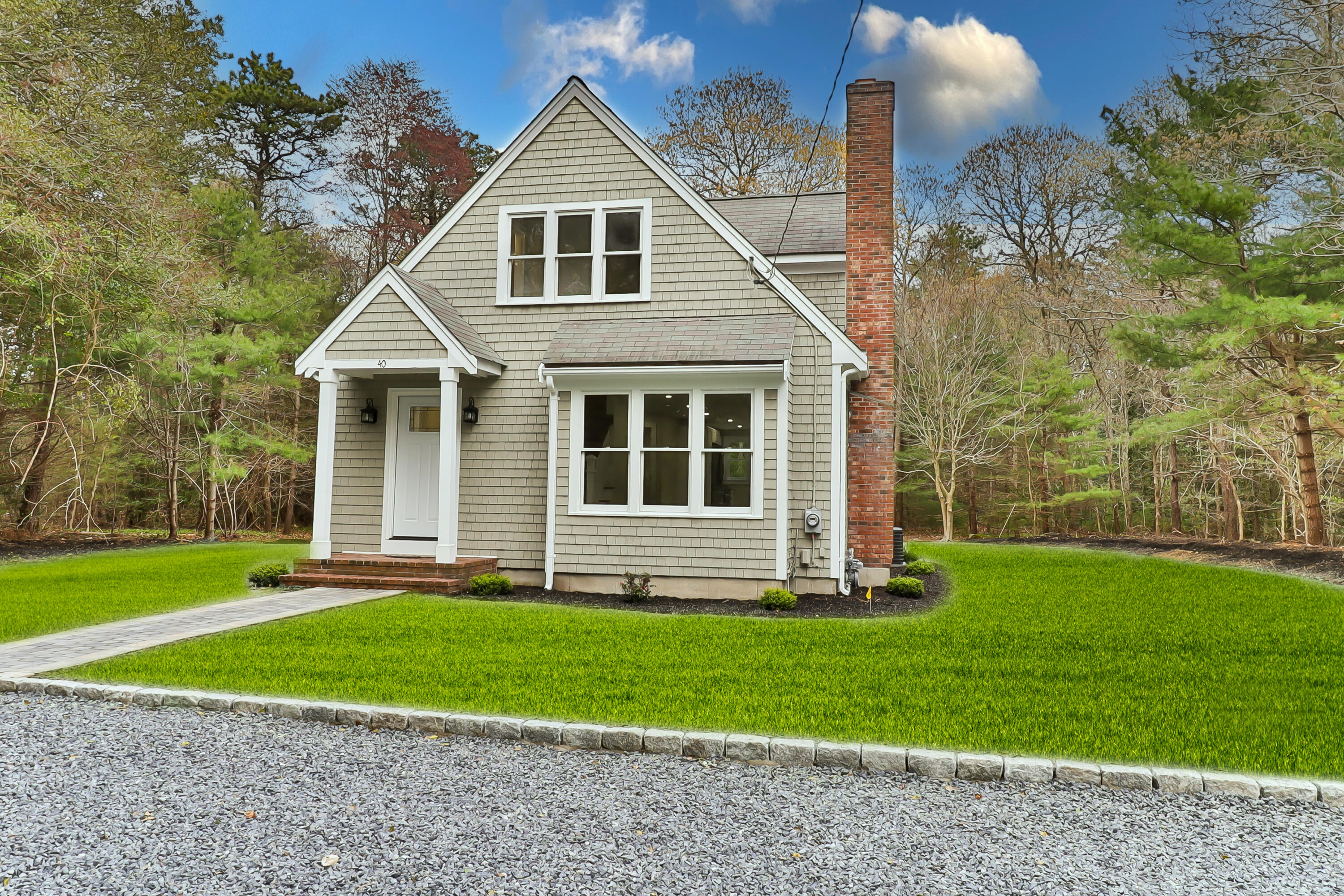 40 Richardson Road Centerville, MA 02632 - Photo 2 of 35 a front view of a house with a yard