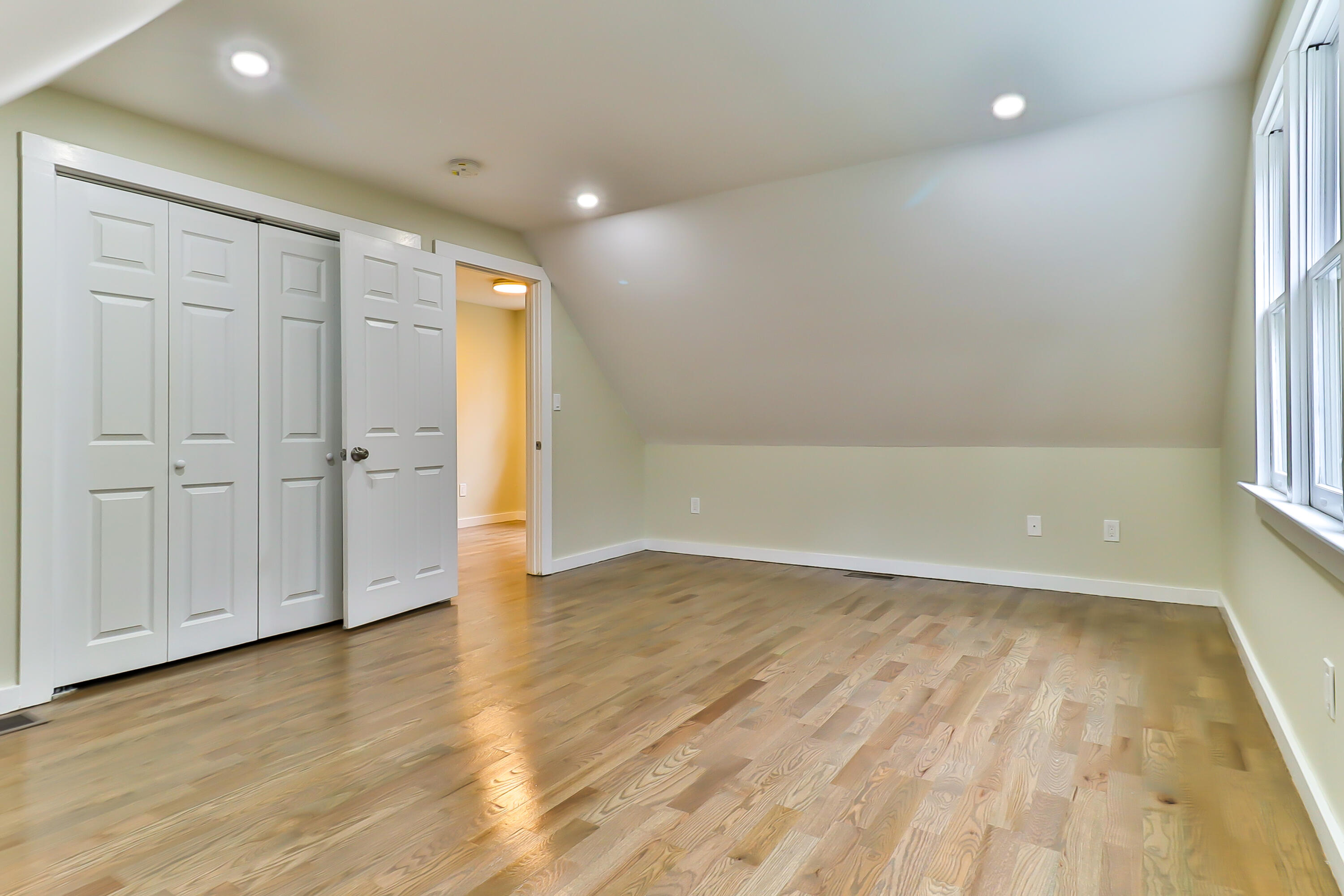40 Richardson Road Centerville, MA 02632 - Photo 25 of 35 an empty room with wooden floor and windows