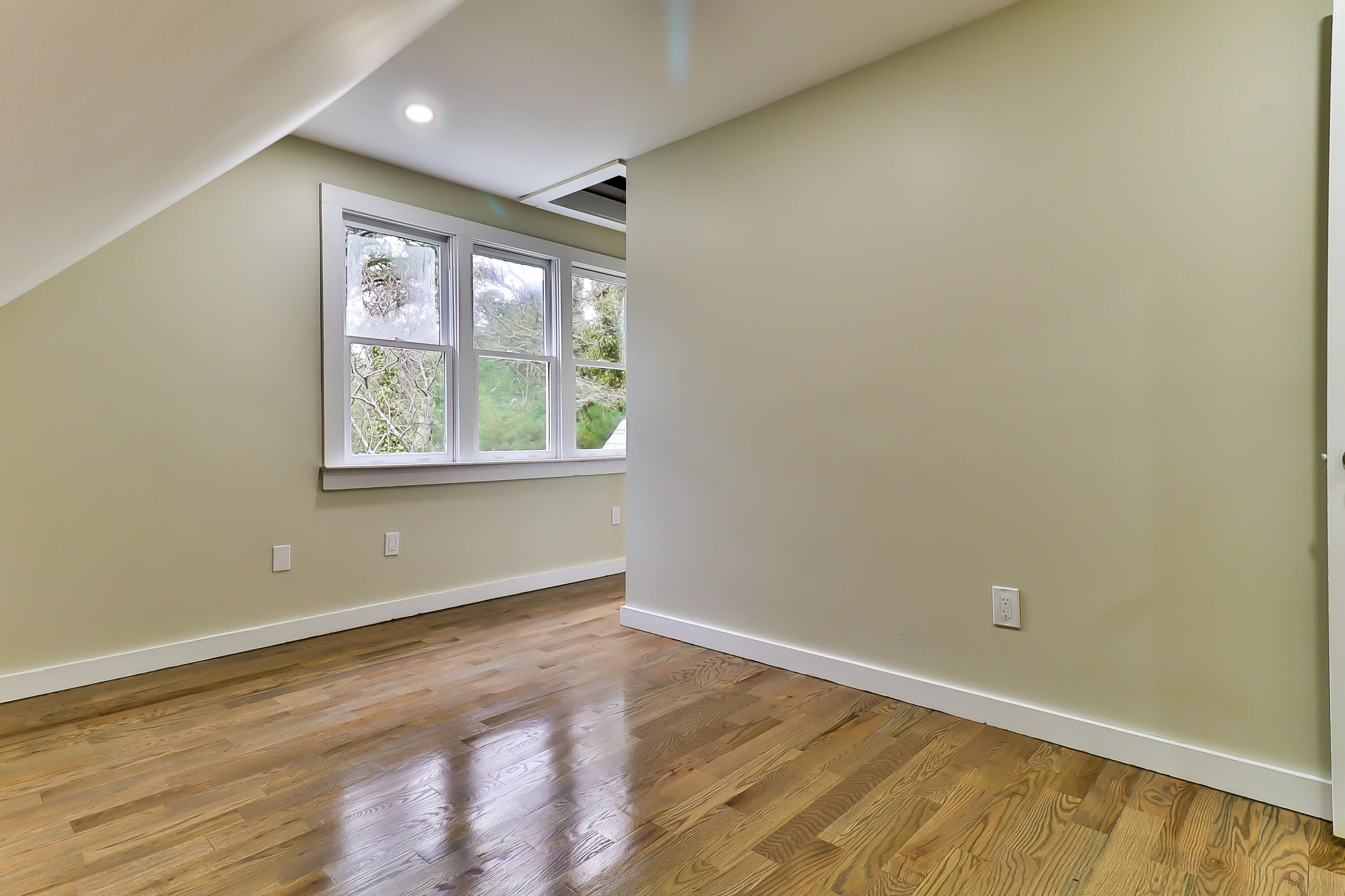 40 Richardson Road Centerville, MA 02632 - Photo 31 of 35 an empty room with wooden floor and windows