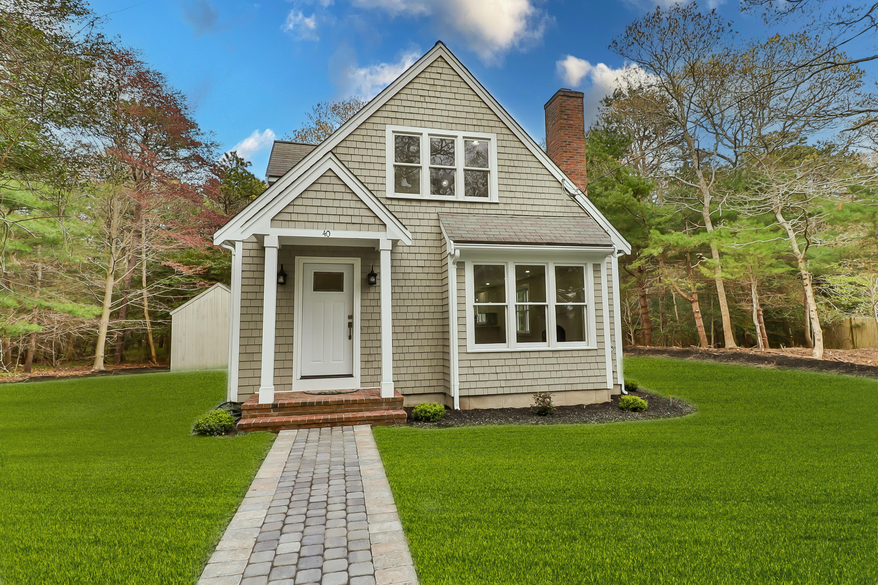 40 Richardson Road Centerville, MA 02632 - Photo 4 of 35 a front view of a house with a yard