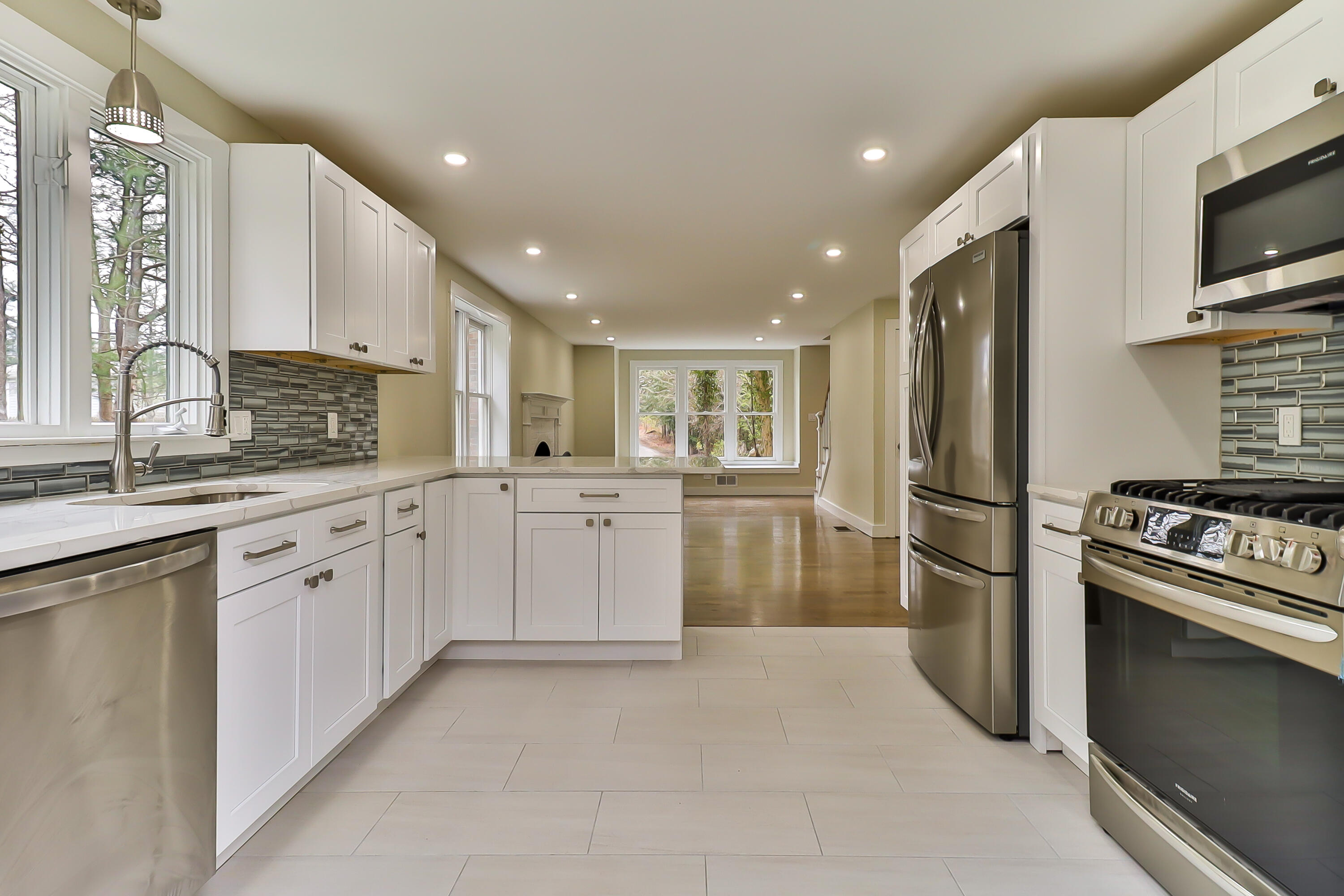 40 Richardson Road Centerville, MA 02632 - Photo 9 of 35 a kitchen with white cabinets sink and stainless steel appliances