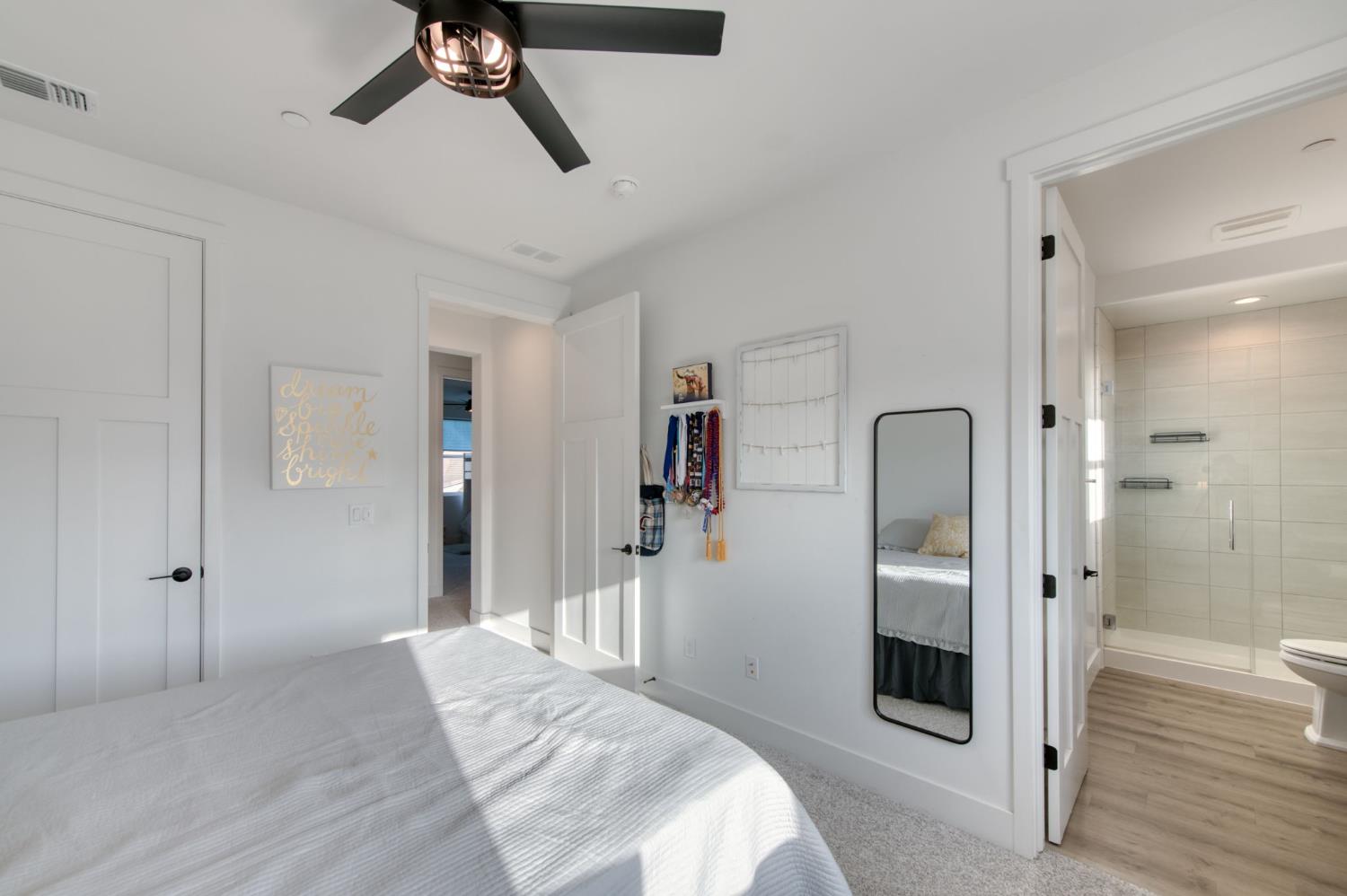 1736 North Renn Avenue Clovis, CA 93619 - Photo 32 of 66 a bedroom with a bed and a walk in closet