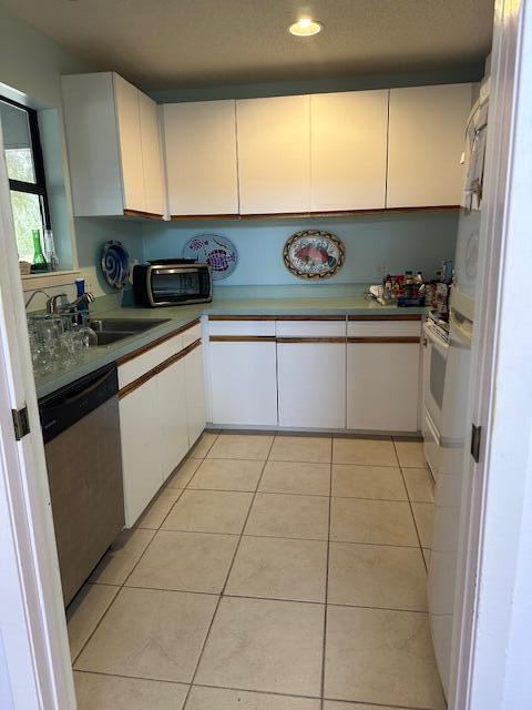 240 Buck Road Santa Rosa Beach, FL 32459 - Photo 13 of 17 a kitchen with a sink a stove and cabinets