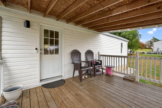 a view of a deck with wooden floor and outdoor space