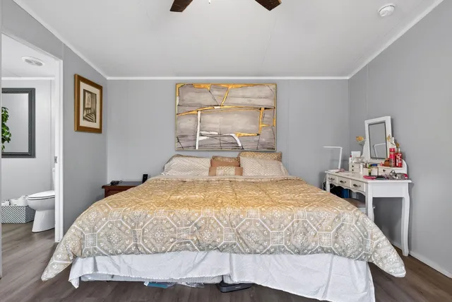 a bedroom with a bed and a table