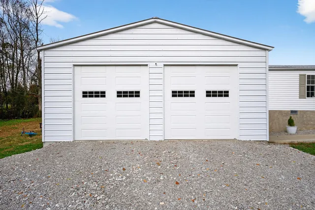 a kitchen with kitchen island a stove a sink and cabinets