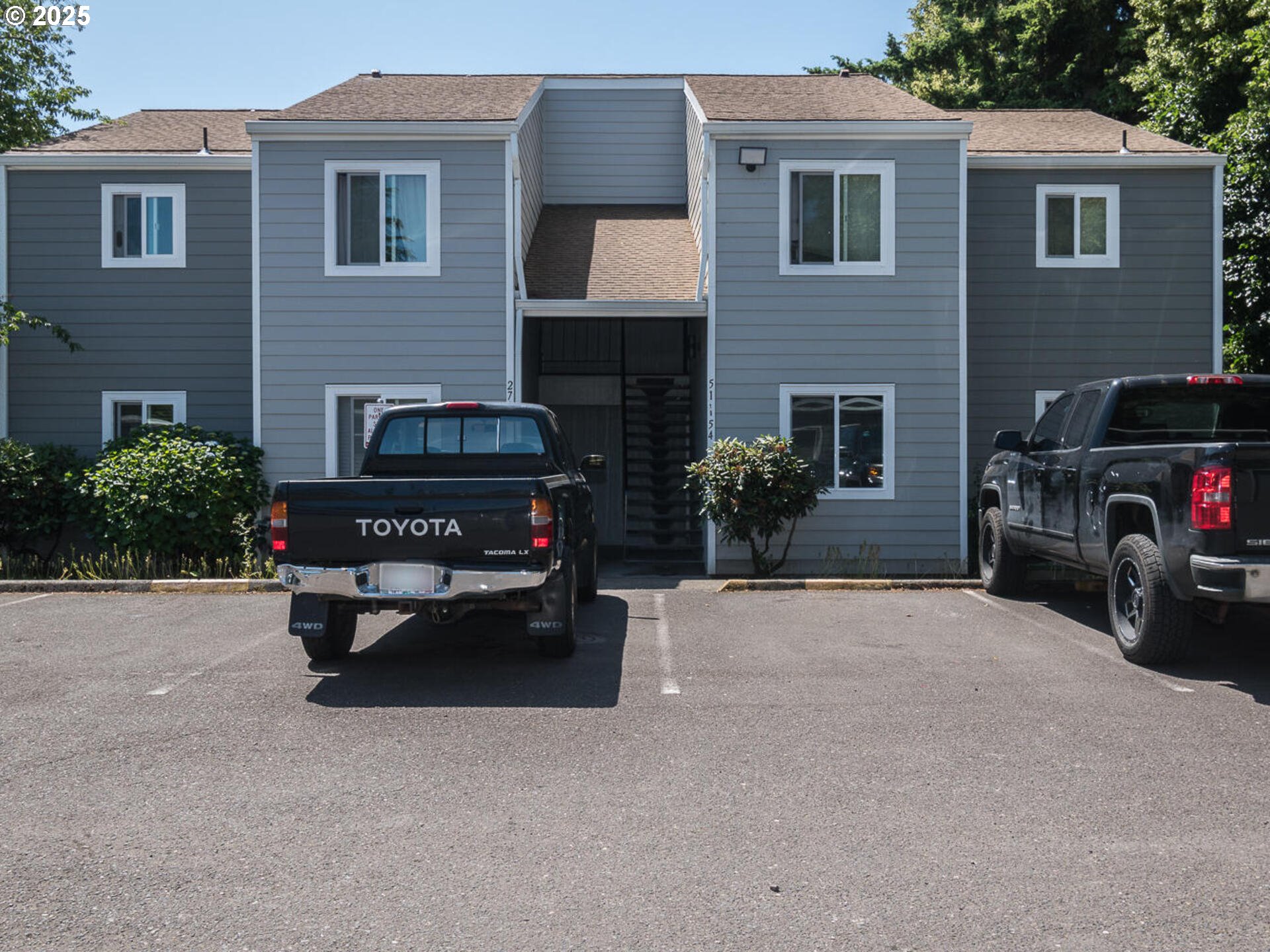 2712 Southeast 138th Avenue, Unit 53 Portland, OR 97236 - Photo 1 of 36 a car parked in front of a house