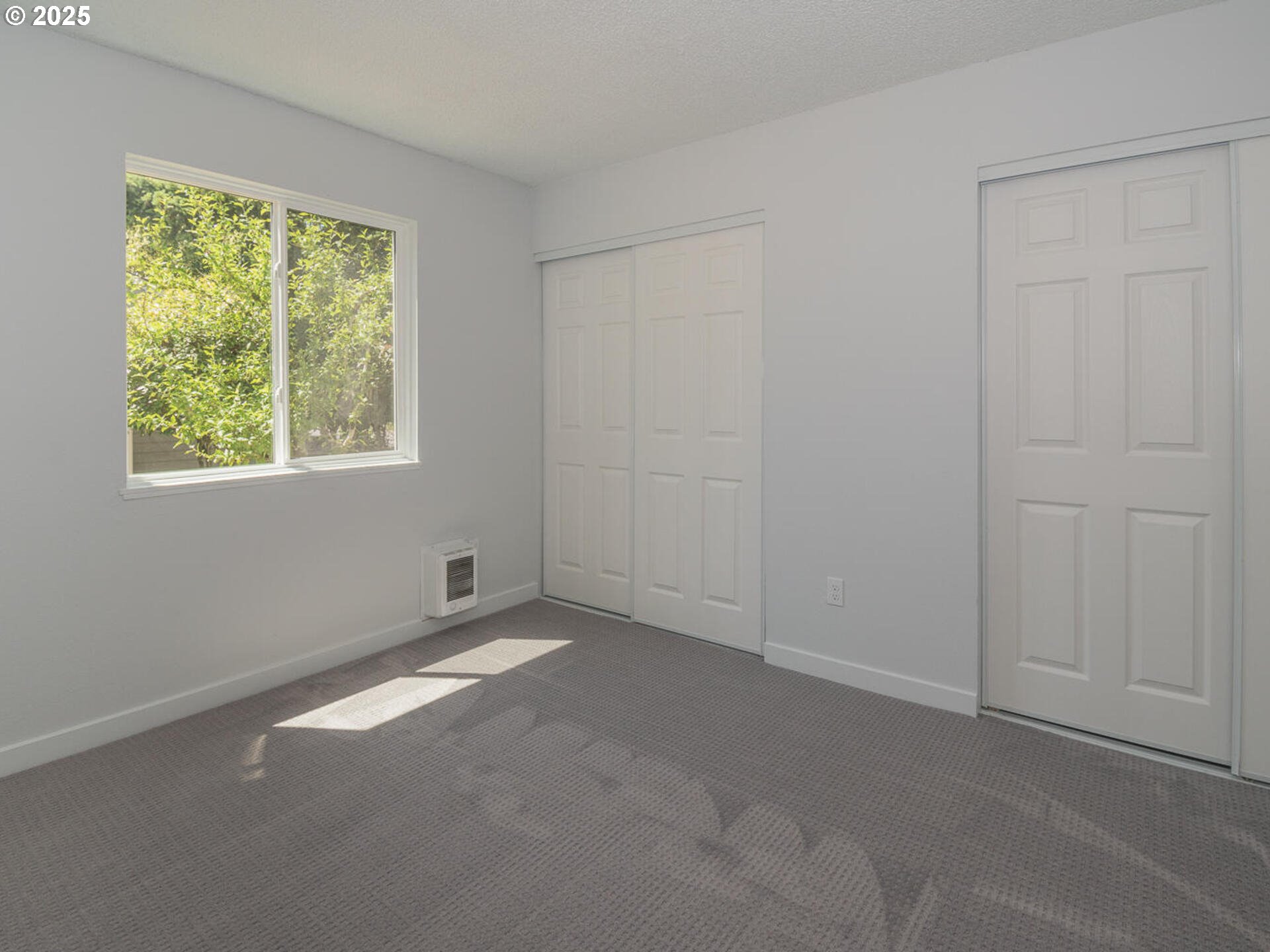 2712 Southeast 138th Avenue, Unit 53 Portland, OR 97236 - Photo 12 of 36 an empty room with windows