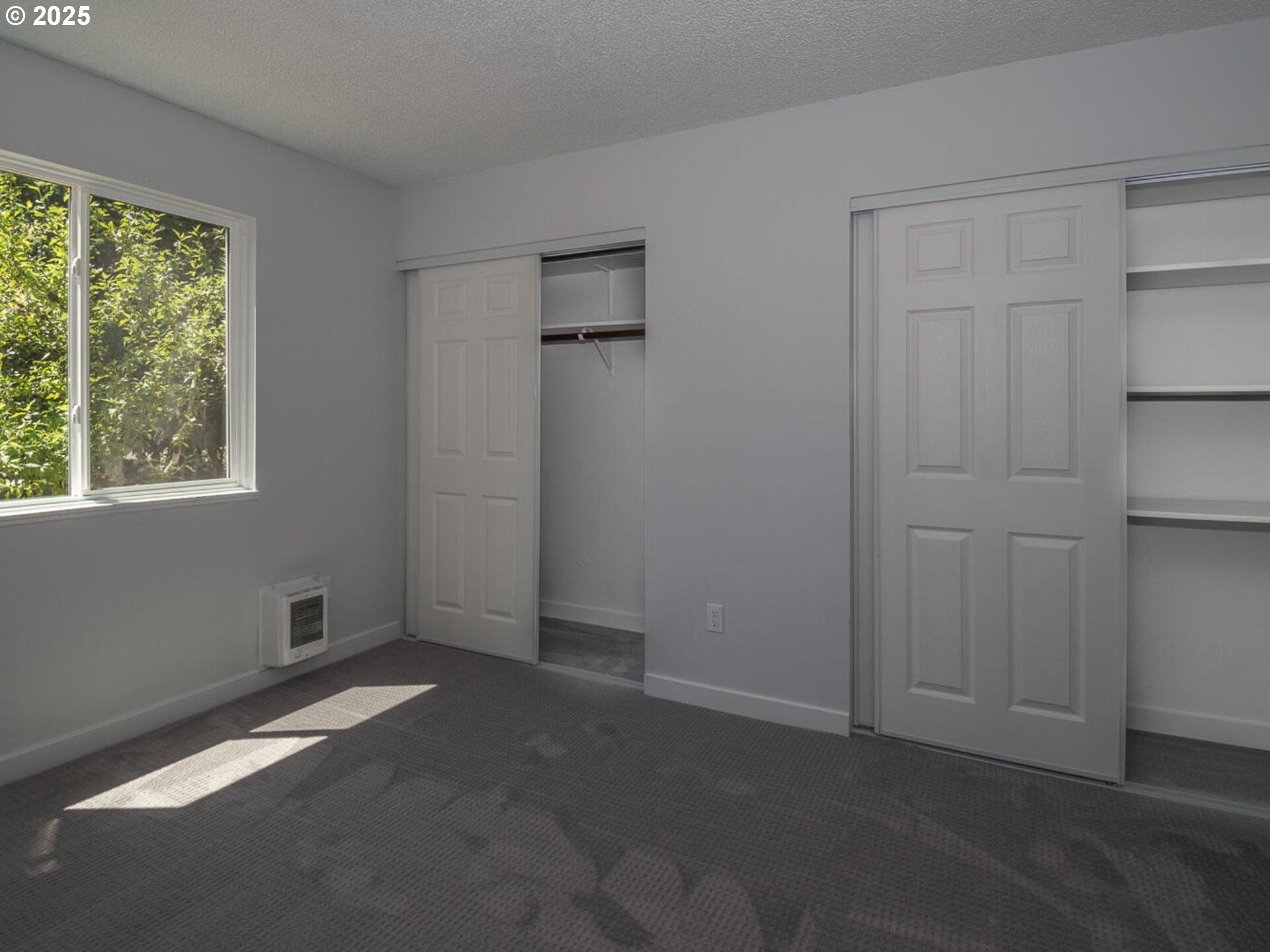 2712 Southeast 138th Avenue, Unit 53 Portland, OR 97236 - Photo 13 of 36 a view of an empty room with a window