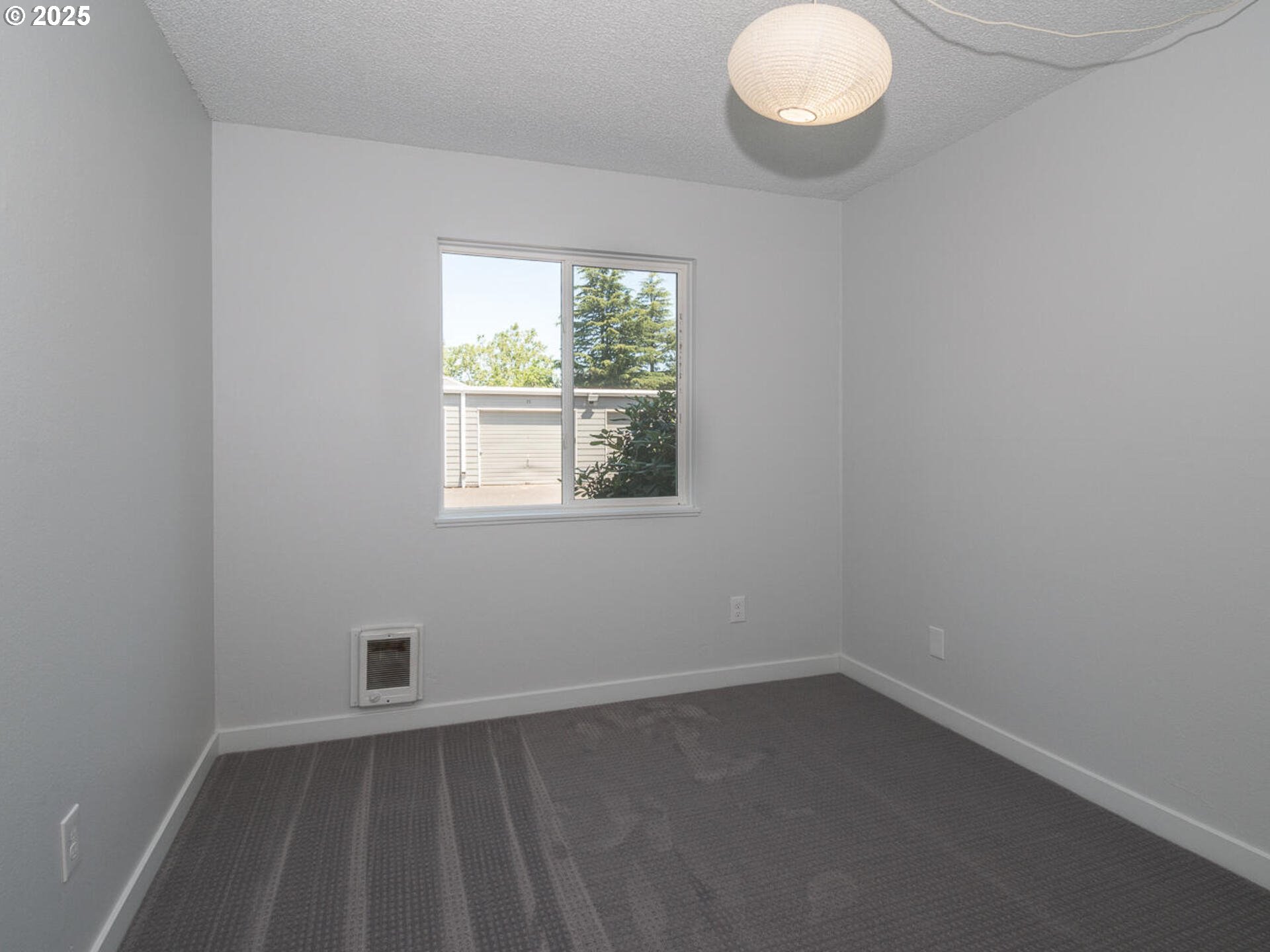 2712 Southeast 138th Avenue, Unit 53 Portland, OR 97236 - Photo 15 of 36 an empty room with a window