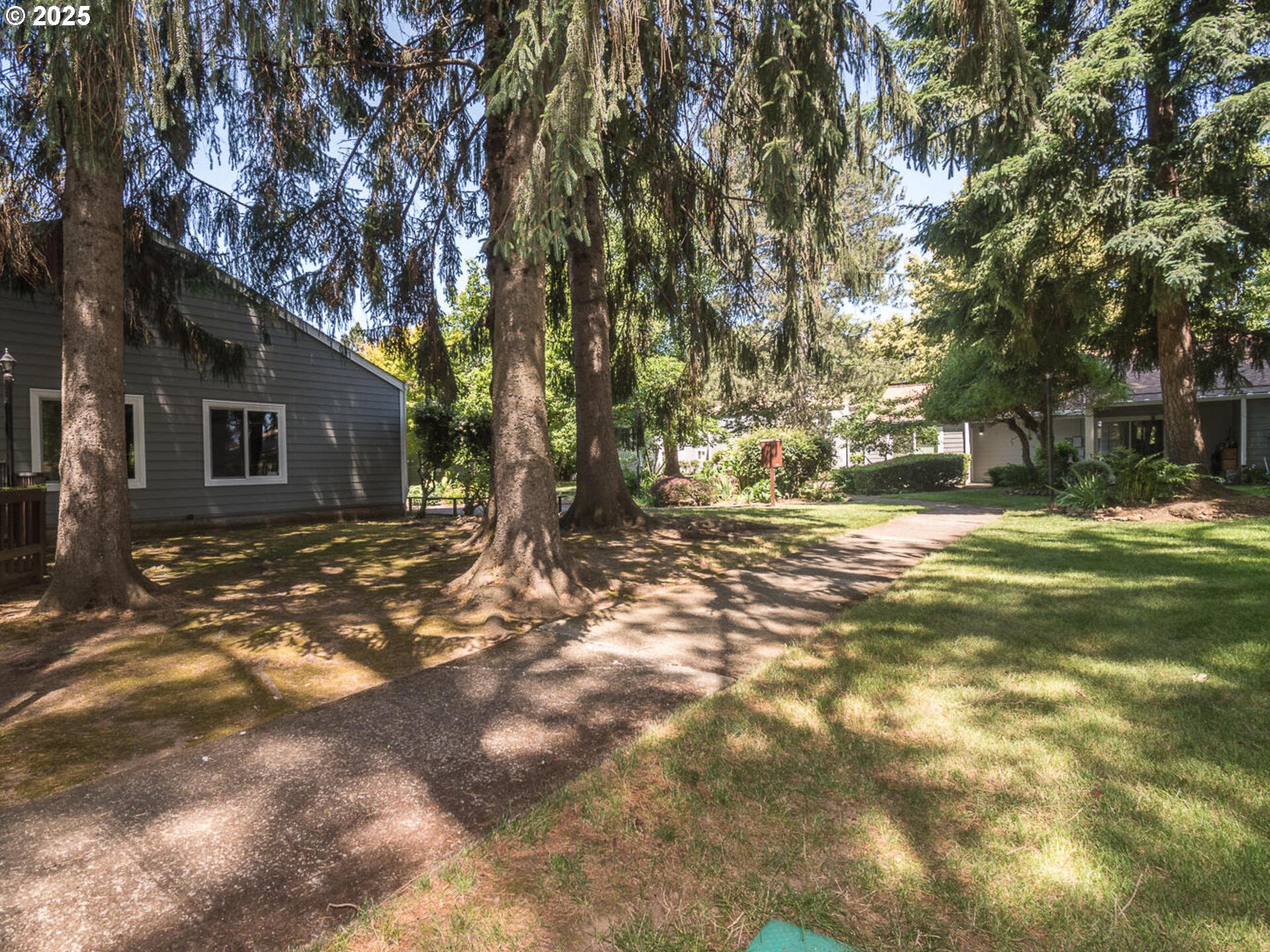 2712 Southeast 138th Avenue, Unit 53 Portland, OR 97236 - Photo 3 of 36 a view of a tree in front of a house
