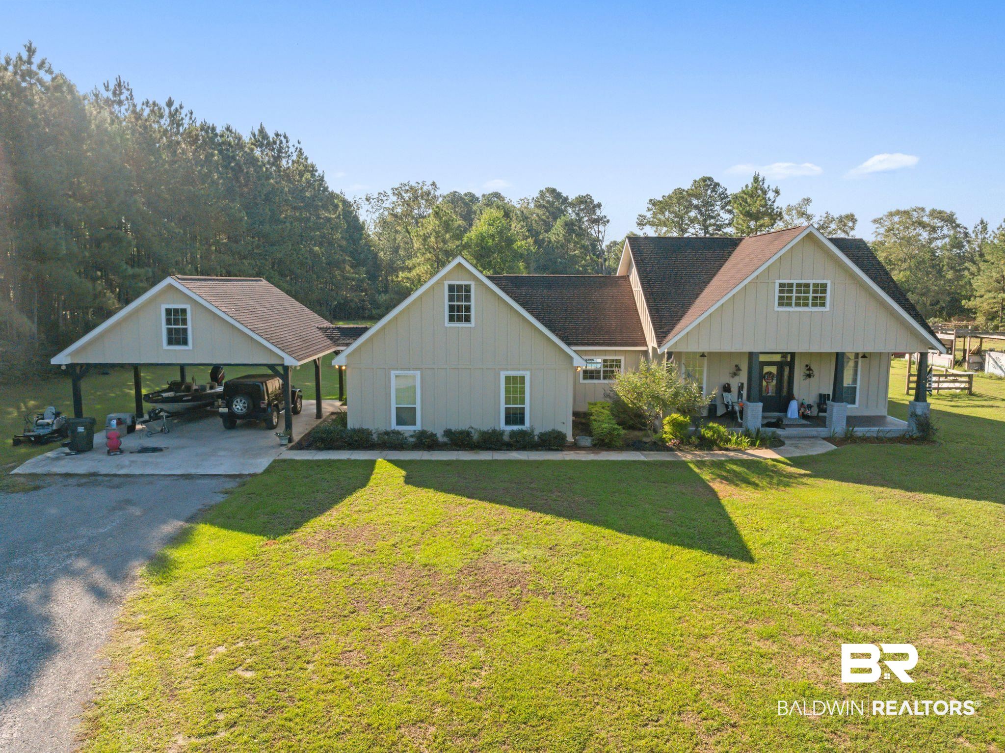 15635 North A N Brady Road Bay Minette, AL 36507 - Photo 1 of 51 Exterior space with a front yard, a porch, and a carport