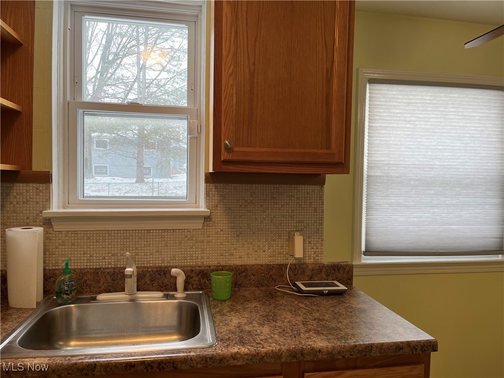 15405 Corkhill Road Maple Heights, OH 44137 - Photo 13 of 50 Kitchen featuring sink and backsplash