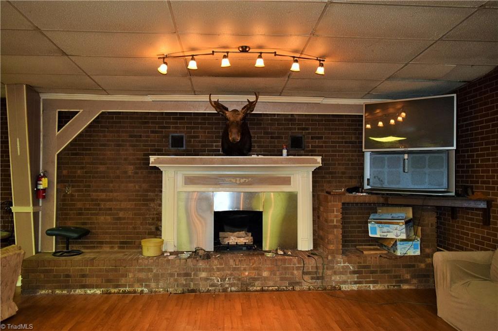 490 K Fork Road Madison, NC 27025 - Photo 25 of 30 Lounge fireplace